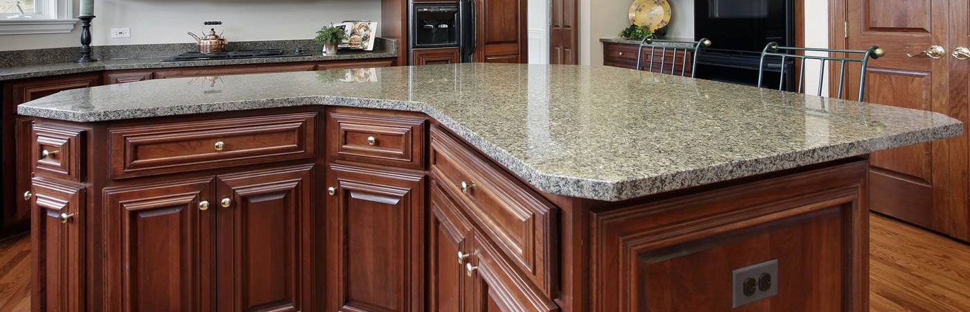 Large island granite countertop that is custom cut with rounded corners.