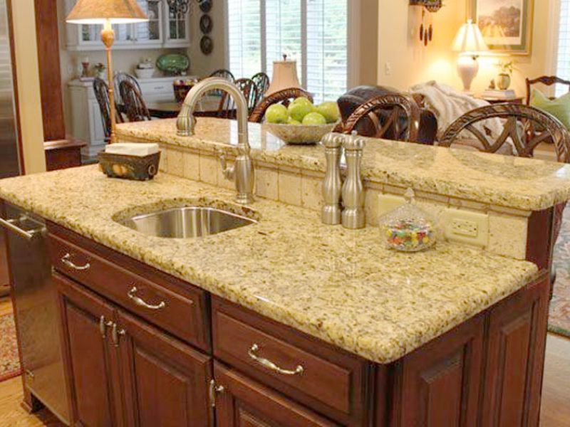 Renovation on a kitchen island with a new granite countertop.